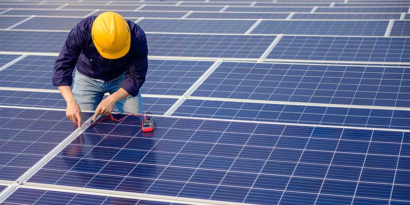 Man setting up solar pannel