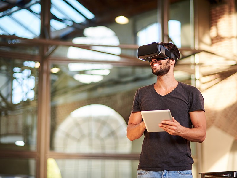Man using virtual reality simulator headset