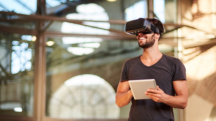 Man using virtual reality simulator headset