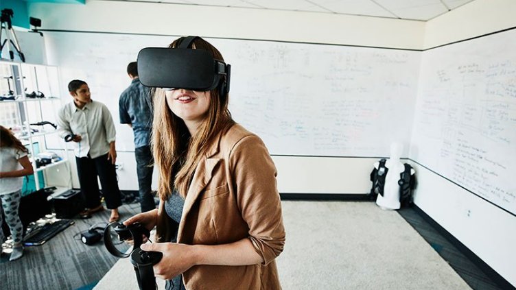 Female engineer using virtual reality headset