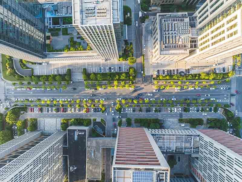 Aerial view of office building with greenery all around