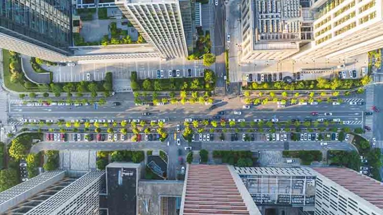 Aerial view of office building with greenery all around