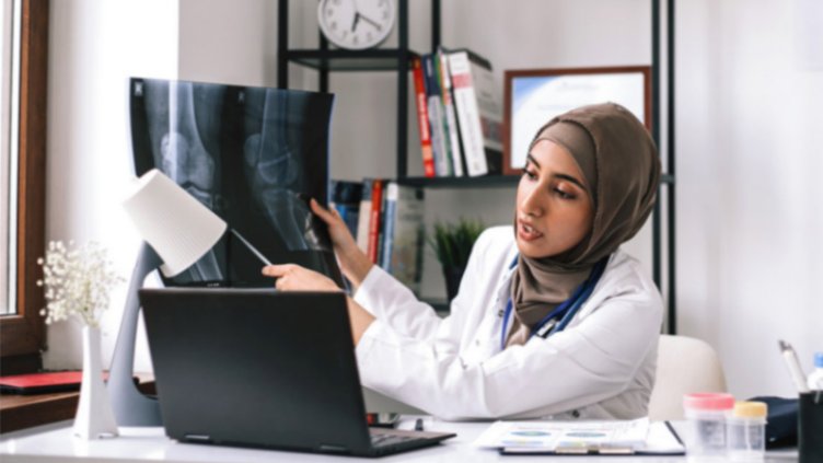 Employee is talking with someone on laptop