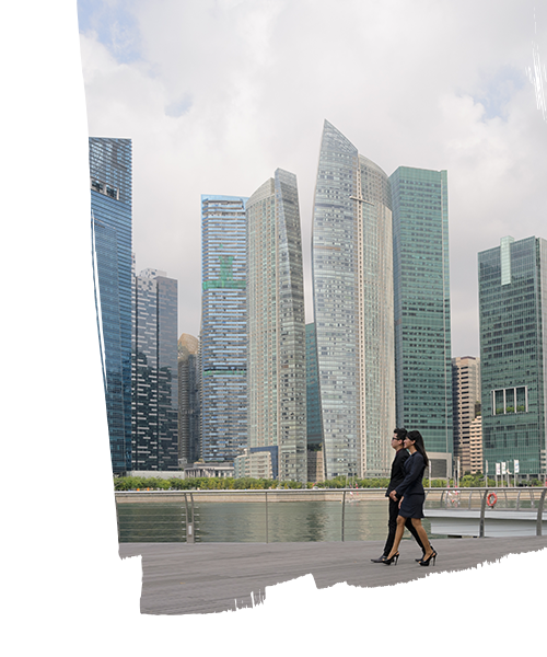 Two employees having conversation while walking beside the real estate buildings in a smart city